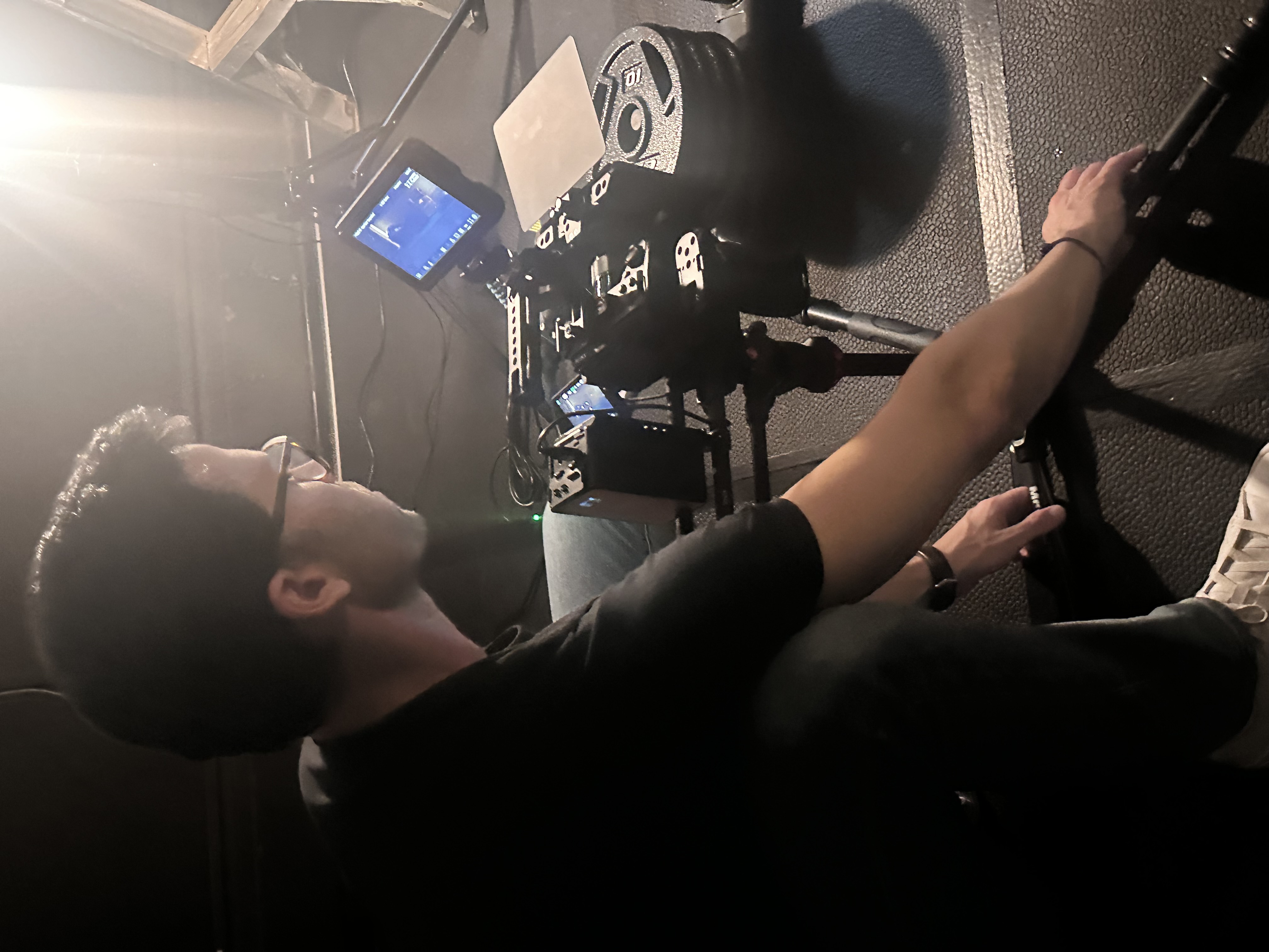 Ryan Coleman operating a cinema camera